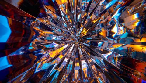 Radiating crystal prism burst reflecting cool blue and warm amber in radial geometric explosion
