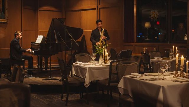 Intimate Candlelit Jazz Duo Playing Grand Piano and Saxophone in Elegant Dinner Lounge