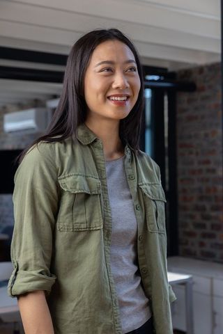 Confident asian professional woman in contemporary office environment