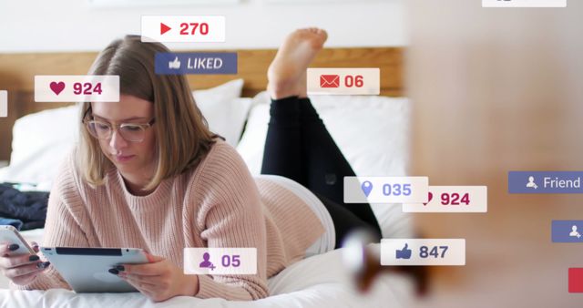 Woman Engaging with Social Media Notifications on Bed with Gadgets - Download Free Stock Images Pikwizard.com