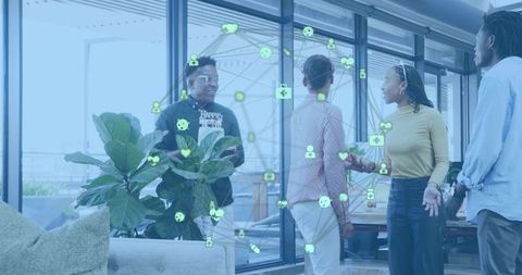 Diverse team collaborating in modern office lounge with digital network overlay