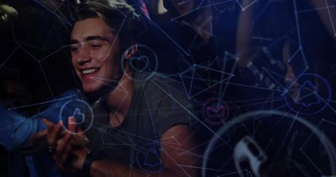 Young man enjoying concert with digital overlay and social media graphics