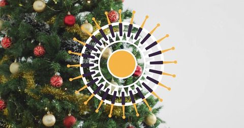 Decorating fir tree with red and gold baubles, tinsel and modern orange graphic overlay