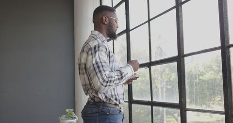 Businessman Contemplating Work While Enjoying Coffee