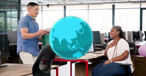 Team presenting holographic globe in open office, collaborating with 3d data visualization