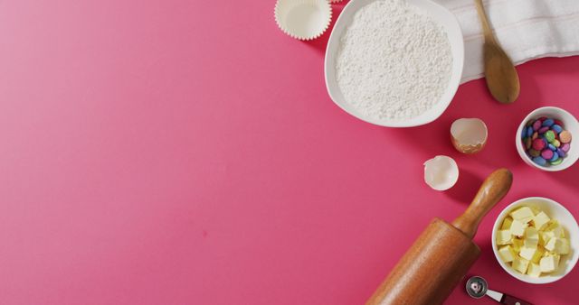Image of baking ingredients and tools lying on pink surface with copy space. baking, food preparing, taste and flavour concept.