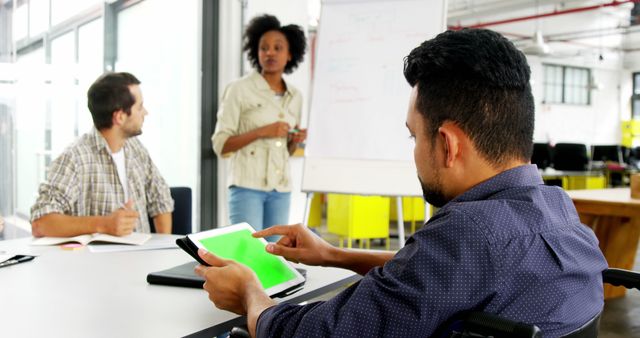 Inclusive Team Collaborating on Project in Modern Office - Download Free Stock Images Pikwizard.com