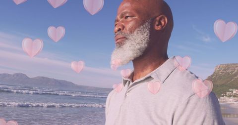 Senior Man Enjoying Beach with Heart Graphics