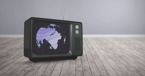 Vintage Television Displaying Globe on Wooden Floor - Download Free Stock Images Pikwizard.com