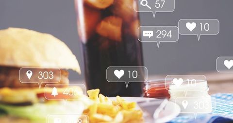 Burger and fries with soda and social icons showing engagement in casual fast food dining