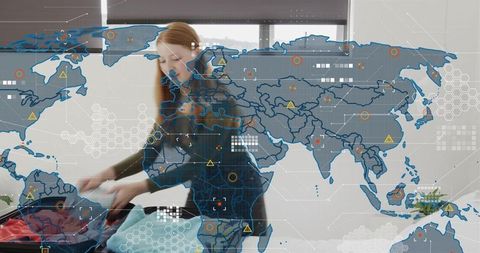 Packing tech traveler: red-haired woman arranging clothes in suitcase with world map hud