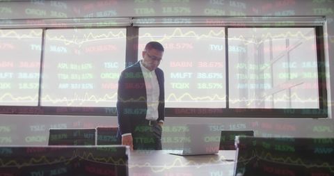 Businessman Analyzing Stock Market Trends in Corporate Office