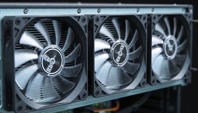 Spinning 120mm axial fans cooling radiator inside pc chassis for high-performance airflow