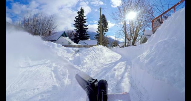 Man clearing snow with snow blower during winter 4k
