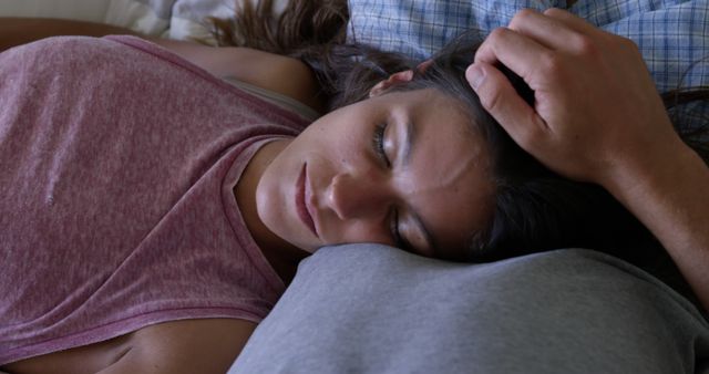 Young Woman Resting Head on Pillow in Casual Clothing with Partner - Download Free Stock Images Pikwizard.com