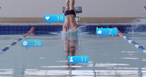 Competitive swimmer diving into indoor pool with social media reaction bubbles and motion splash ref