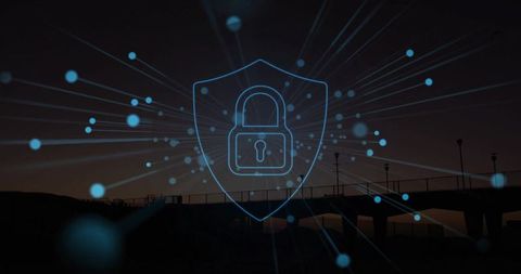 Glowing Padlock on Shield with Network Nodes over Silhouetted Pier