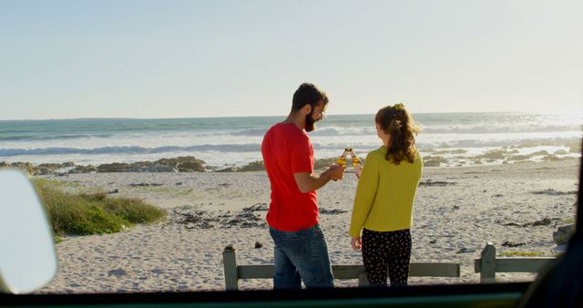 Happy Couple Having Beers on Sunny Beach - Download Free Stock Images Pikwizard.com