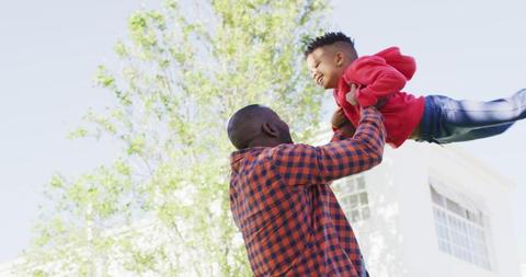 Father Lifting Happy Son Outdoors on Sunny Day - Download Free Stock Images Pikwizard.com