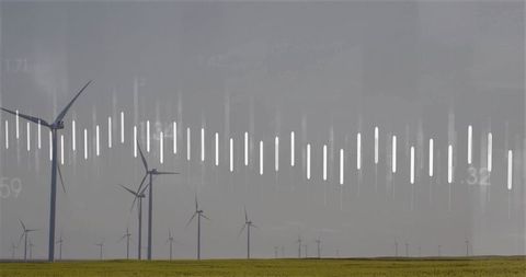 Wind turbines generating renewable energy with data overlay