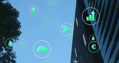 Skyscraper displaying green energy icons and CO2 data floating against clear blue sky