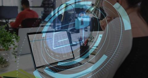 Woman Analyzing Spreadsheet with Cybersecurity HUD Lock Overlay in Open-Plan Coworking