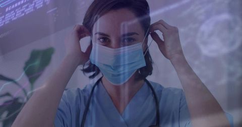 Nurse Adjusting Mask in High-Tech Medical Environment