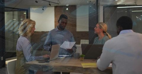 Business team presenting strategy in modern glass office collaborative planning meeting