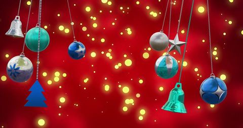 Festive Christmas Baubles on Vibrant Red Background with Lights