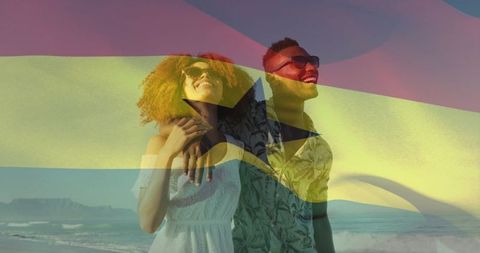 Ghana flag overlay celebrating romantic ghanaian couple embracing on sunny beach