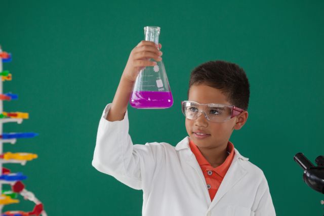 Young Boy Conducting Science Experiment in Classroom - Download Free Stock Photos Pikwizard.com