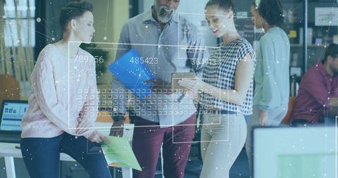 Team engaged in financial data processing and analysis in modern office