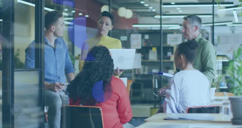 Diverse Business Team Collaborating Through Digital Interfaces