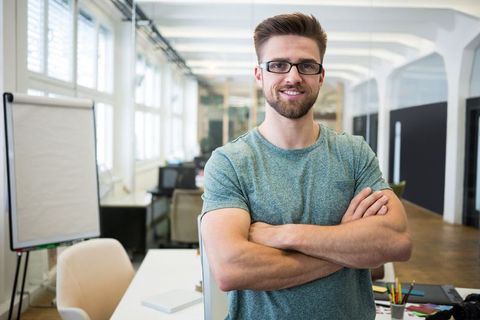 Confident Professional in Modern Open-Plan Office Environment