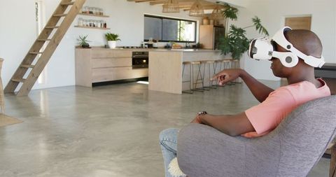 Man Experiencing Virtual Reality in Stylish Home Interior