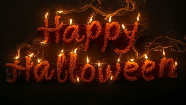 Glowing halloween message with candlelit wax text