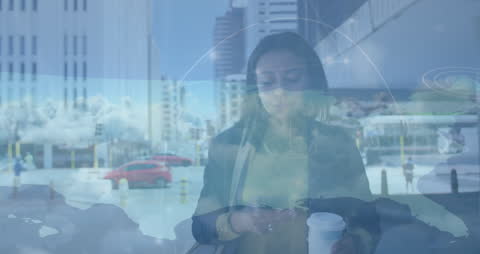 Multitasking Businesswoman Using Smartphone in Urban Environment