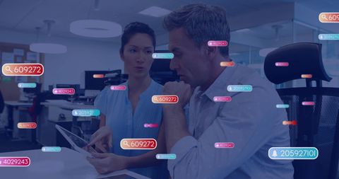 Digital Data Icons Surrounding Business Professionals in Modern Office