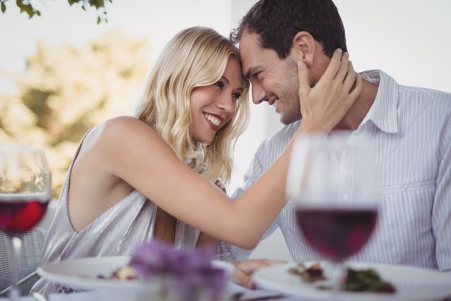Romantic Couple Embracing at Restaurant Table - Download Free Stock Photos Pikwizard.com