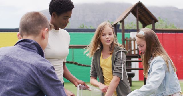 Children Collaborating in Outdoor Playground with Teacher - Download Free Stock Images Pikwizard.com