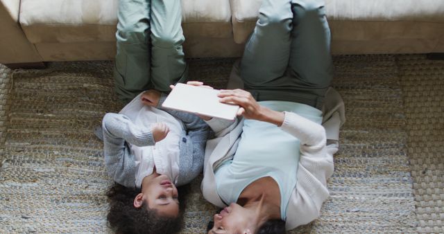 Mom and Daughter Reading Digital Tablet Together on Floor at Home - Download Free Stock Images Pikwizard.com