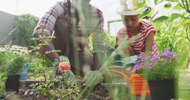 Father and Daughter Gardening Together in Blooming Garden - Download Free Stock Images Pikwizard.com