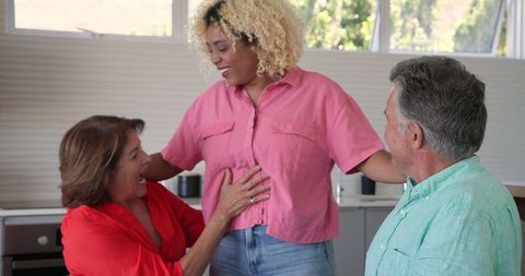 Multigenerational Family Celebrating Pregnancy at Home