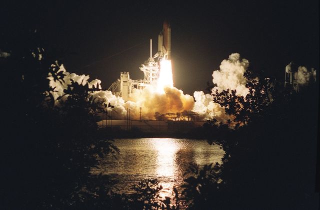 KENNEDY SPACE CENTER, Fla. - Trees and shrubs are silhouetted on the near bank by the brilliant exhaust of Space Shuttle Columbia as it hurtles into the pre-dawn sky on mission STS-109.  Liftoff of Columbia occurred at 6:22:02:08 a.m. EST (11:22:02:08 GMT). This was the 27th flight of the vehicle and 108th in the history of the Shuttle program.  The goal of the mission is the maintenance and upgrade of the Hubble Space Telescope, to be carried out in five spacewalks.  The crew comprises Commander Scott D. Altman, Pilot Duane G. Carey, Payload Commander John M. Grunsfeld, and Mission Specialists Nancy Jane Currie, Richard M. Linnehan, James H. Newman and Michael J. Massimino.  After the 11-day mission, Columbia is expected to return to KSC March 12 about 4:35 a.m. EST (09:35 GMT)
