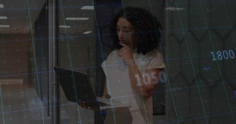 Businesswoman Analyzing Virtual Data Chart in Office Environment