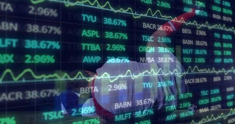 Reclining man wearing santa outfit displaying stock market neon overlay with red arrow