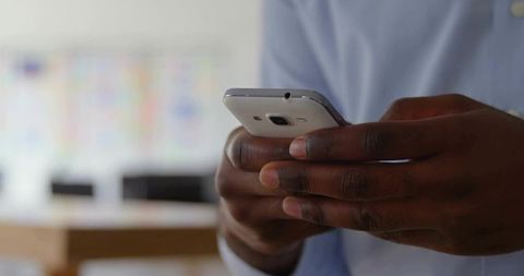 Close-Up of Hands Using Smartphone for Business Communication