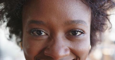 Close-Up Smile of African American Woman with Natural Curly Hair
