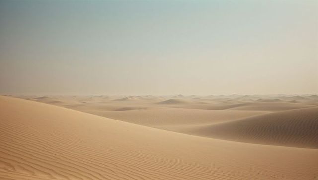 Endless rolling sand dunes in a vast desert landscape