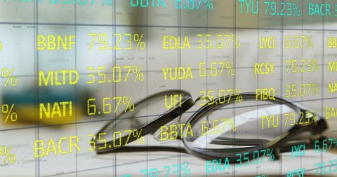Financial Data Reflecting on Glasses with Stock Market Figures - Download Free Stock Images Pikwizard.com